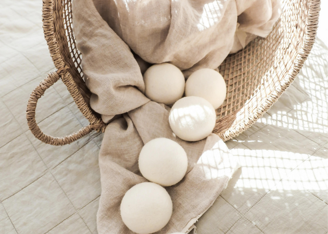 wool dryer balls in laundry basket